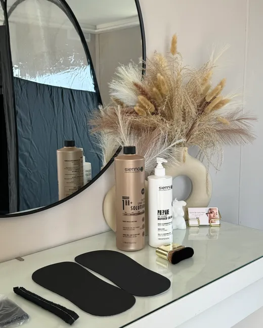 Sienna X solution and barrier cream laid out ready for an appointment in Lucy's studio