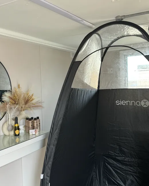 The spray tan booth and Sienna X solutions in Lucy's private Kings Langley studio